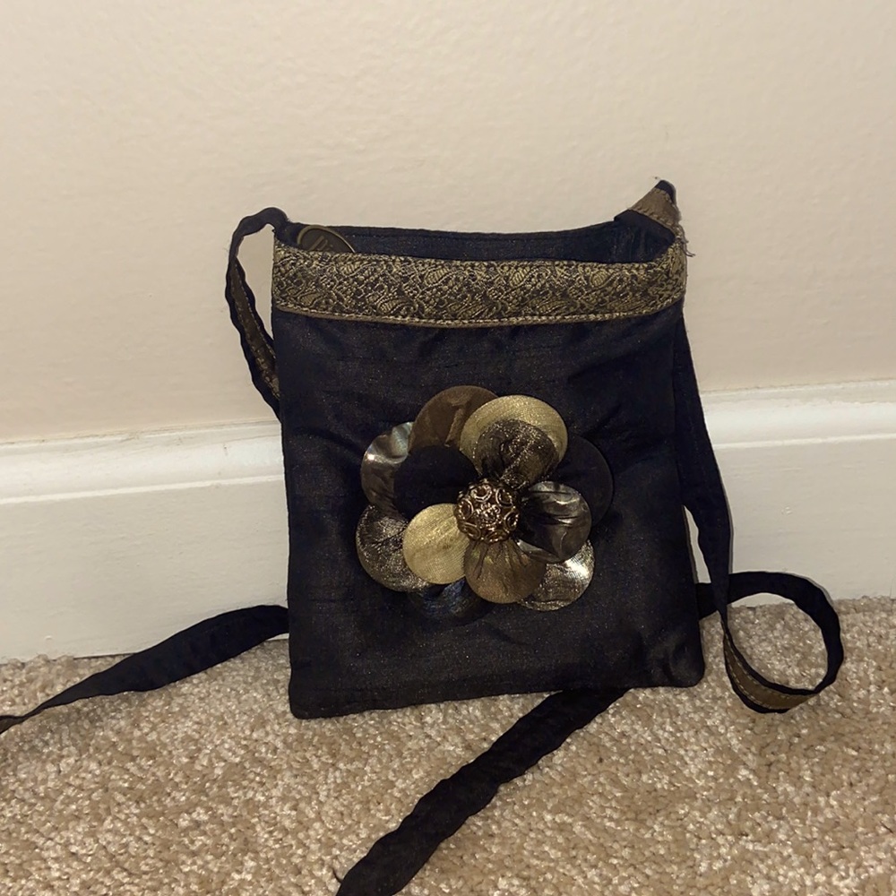gold and black crossbody with floral detailing
